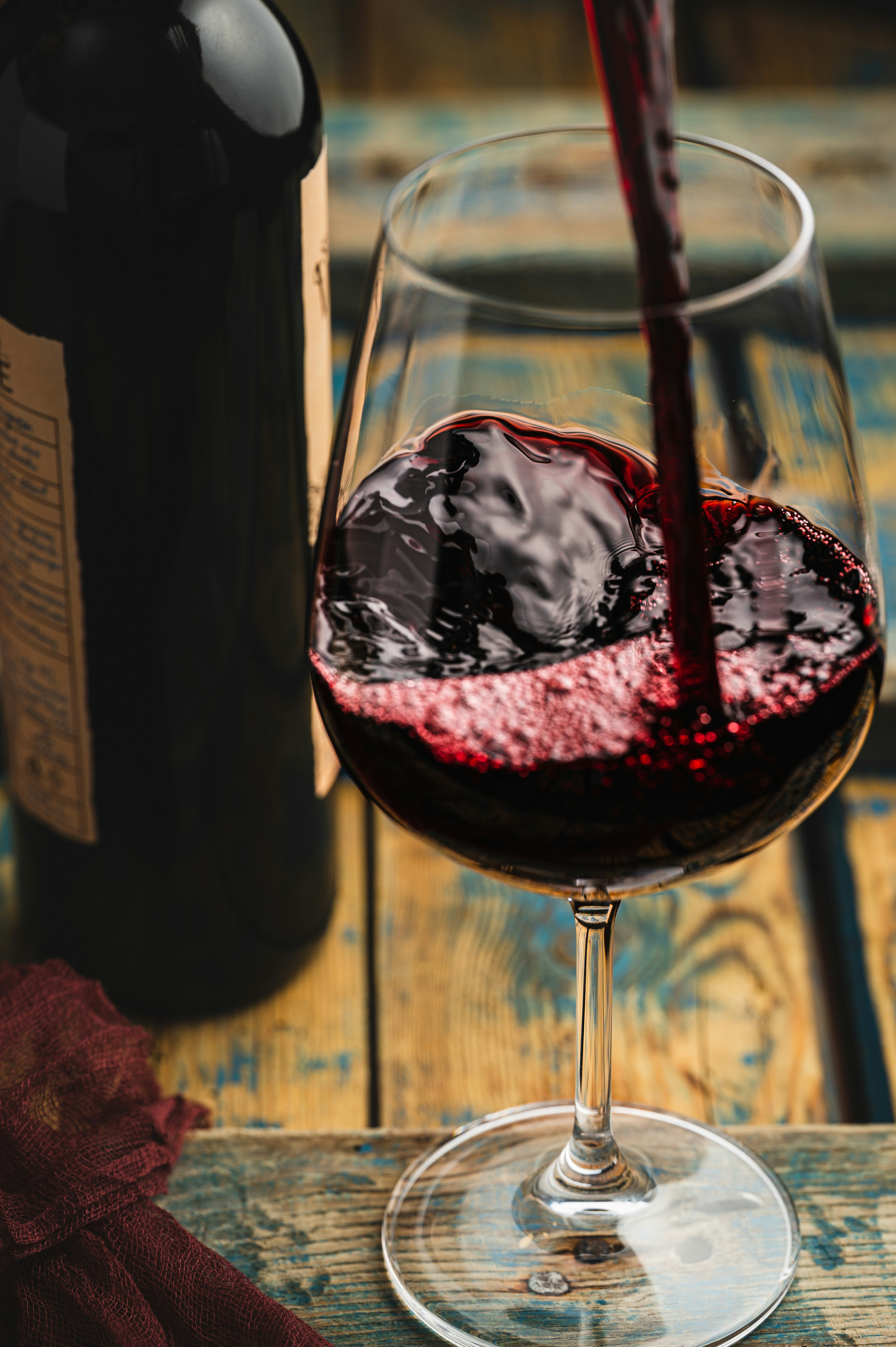 Malbec wine being poured at a winery in Mendoza, Argentina